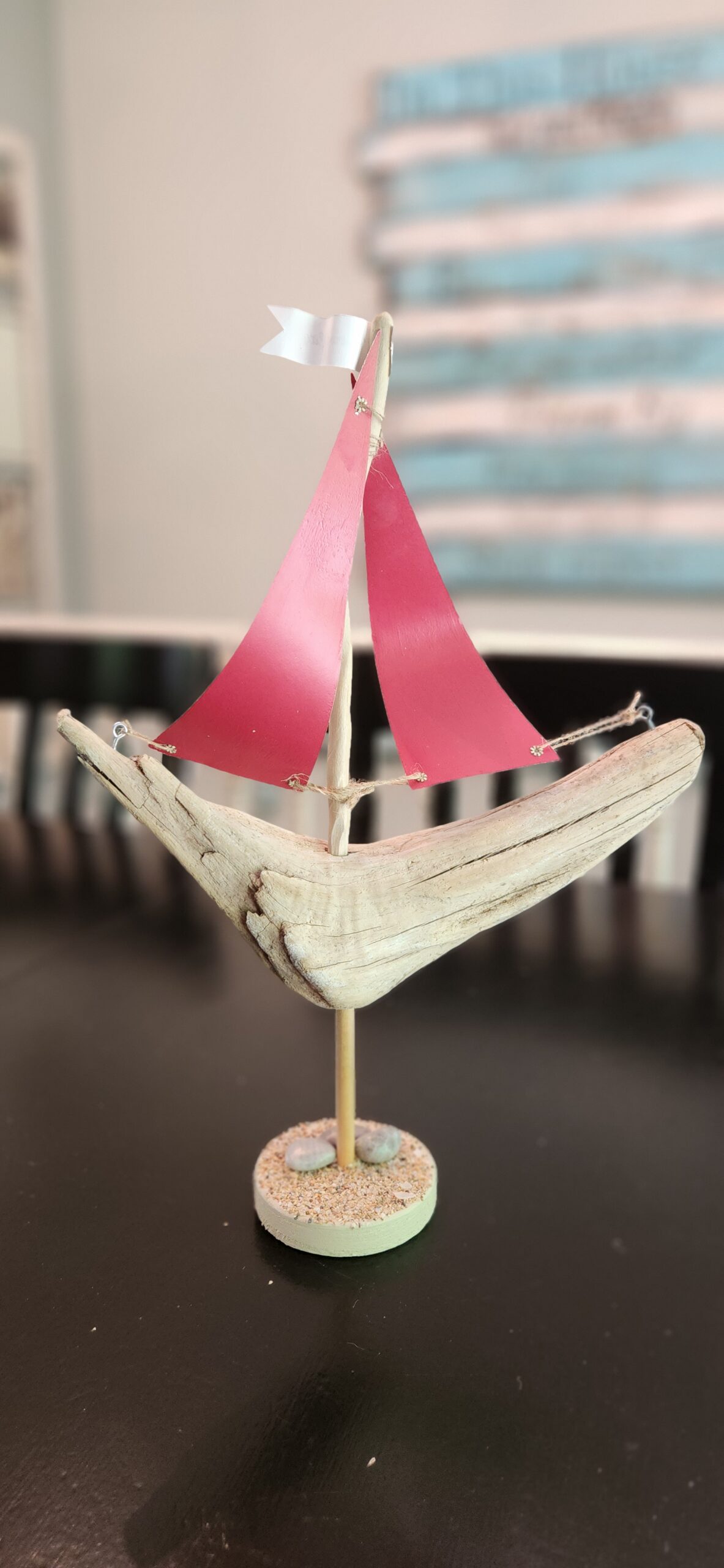 A Unique Sailboat Crafted from Driftwood, Petoskey Stones, Sand, and Map Sails & Traverse City Flag - Image 2