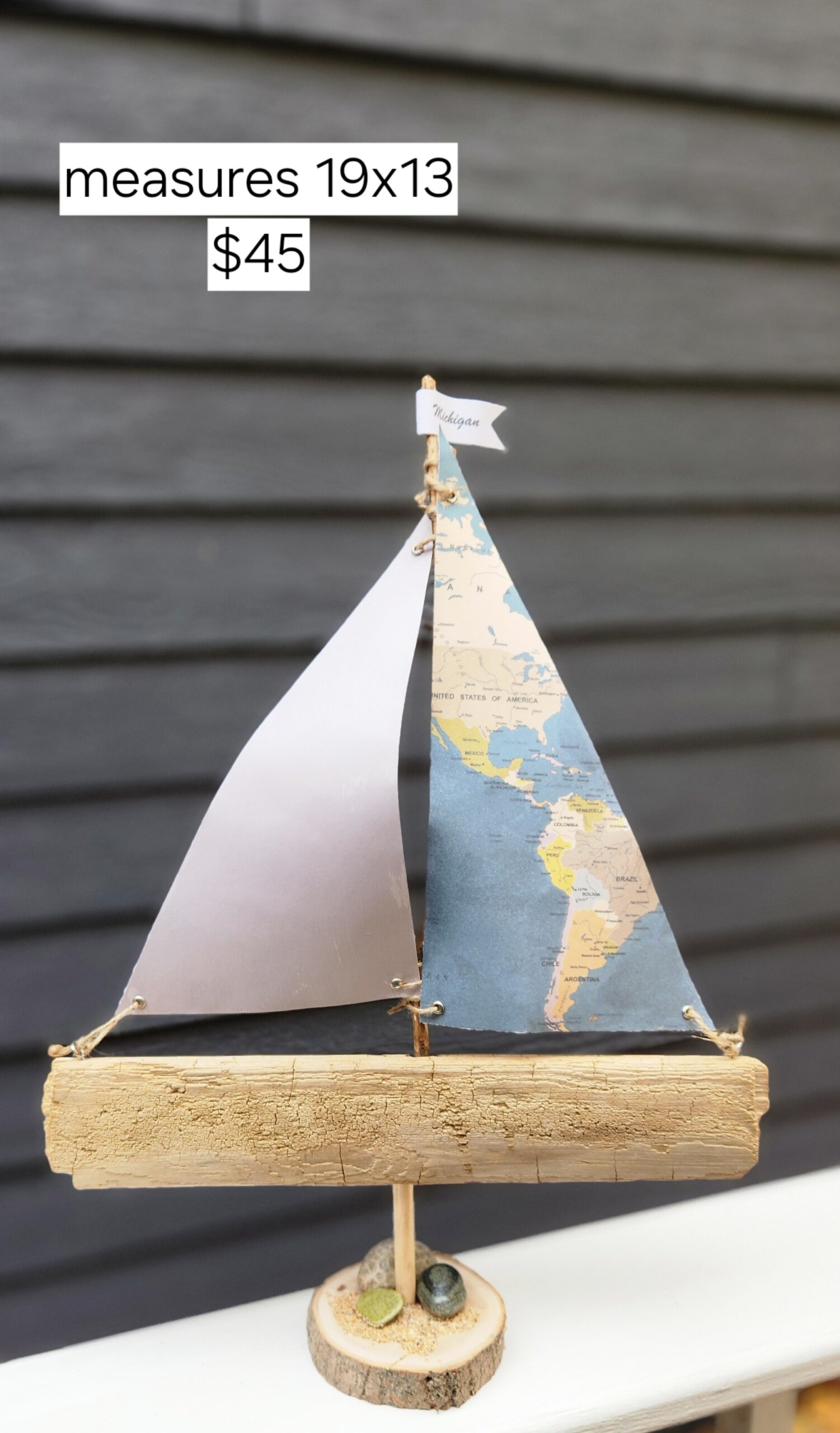 A Unique Sailboat Crafted from Driftwood, Petoskey Stones, Sand, Map Sails & Michigan Flag