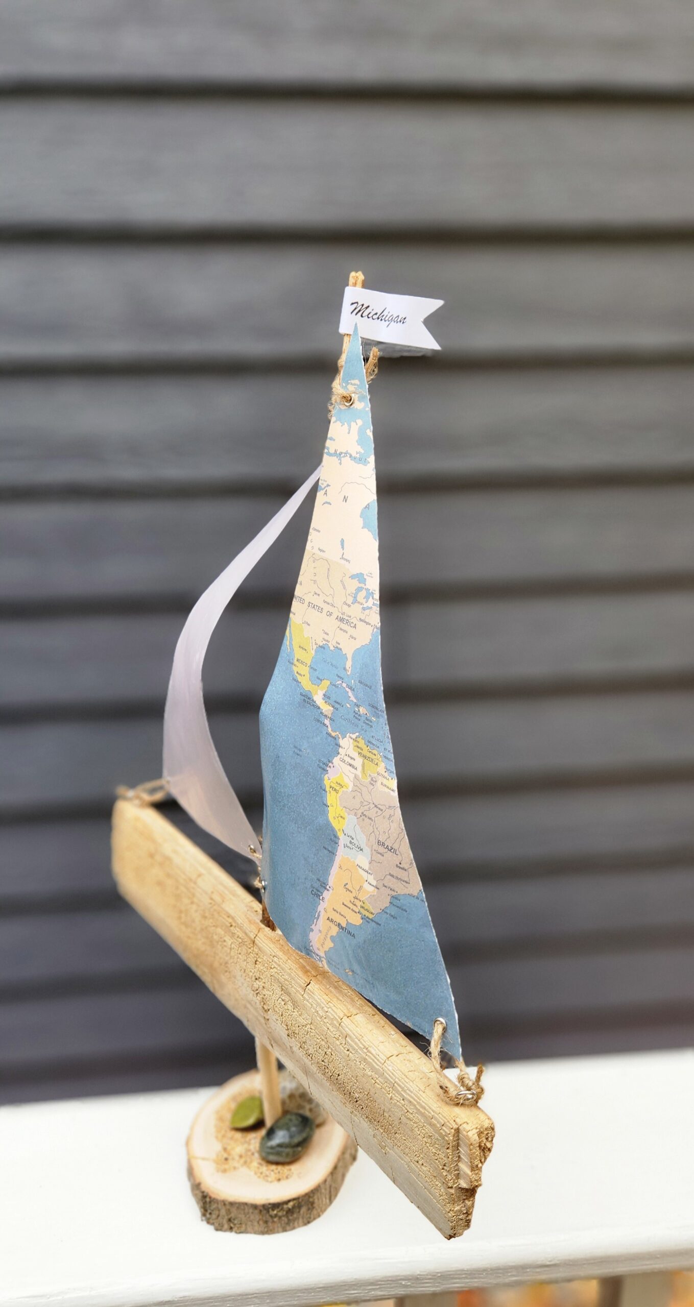 A Unique Sailboat Crafted from Driftwood, Petoskey Stones, Sand, Map Sails & Michigan Flag - Image 2