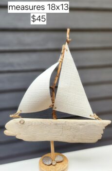 A Unique Sailboat Crafted from Driftwood, Petoskey Stones, Sand, and White Sails