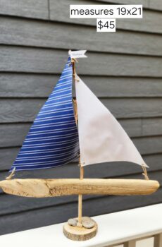 A Unique Sailboat Crafted from Driftwood, Petoskey Stones, Sand, White & Navy Sails with Michigan Flag