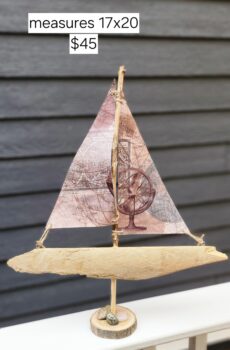 A Unique Sailboat Crafted from Driftwood, Petoskey Stones, Sand, and Map Sails