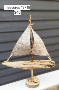 A Unique Sailboat Crafted from Driftwood, Petoskey Stones, Sand, and Map Sails