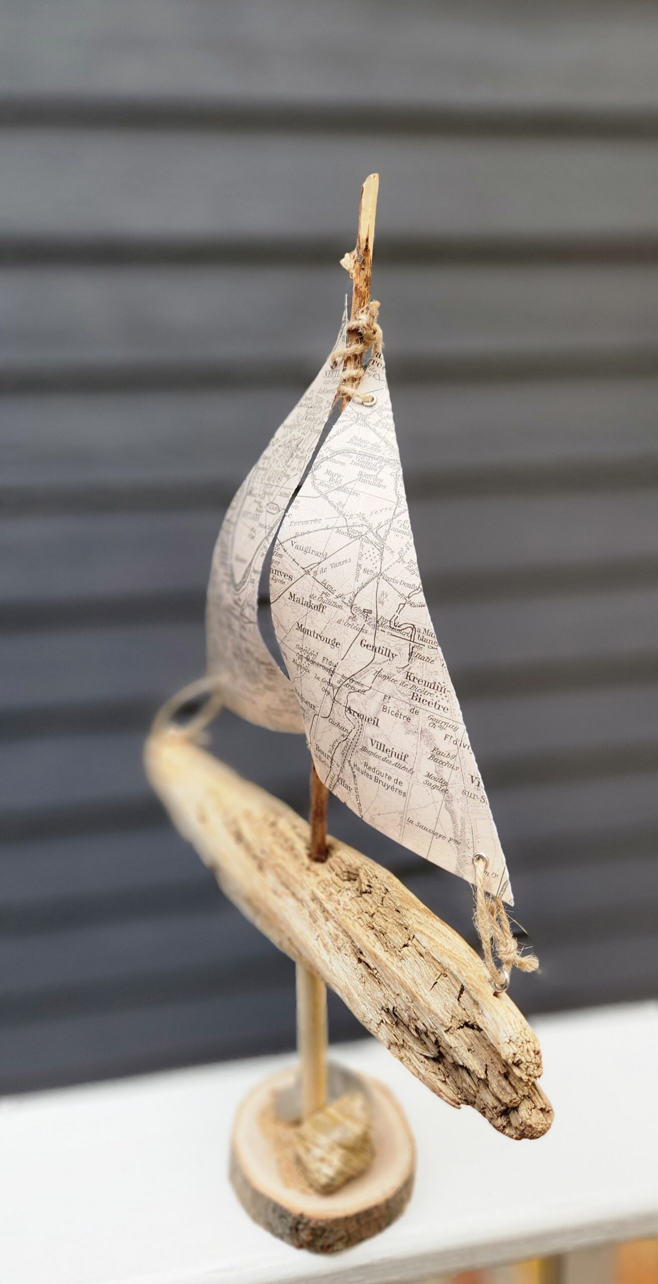 A Unique Sailboat Crafted from Driftwood, Petoskey Stones, Sand, and Map Sails - Image 2
