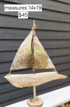 A Unique Sailboat Crafted from Driftwood, Petoskey Stones, Sand, and Map Sails