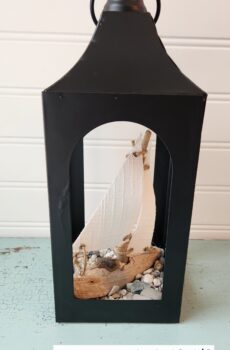 Lantern with Driftwood Sailboat & Beach Stones