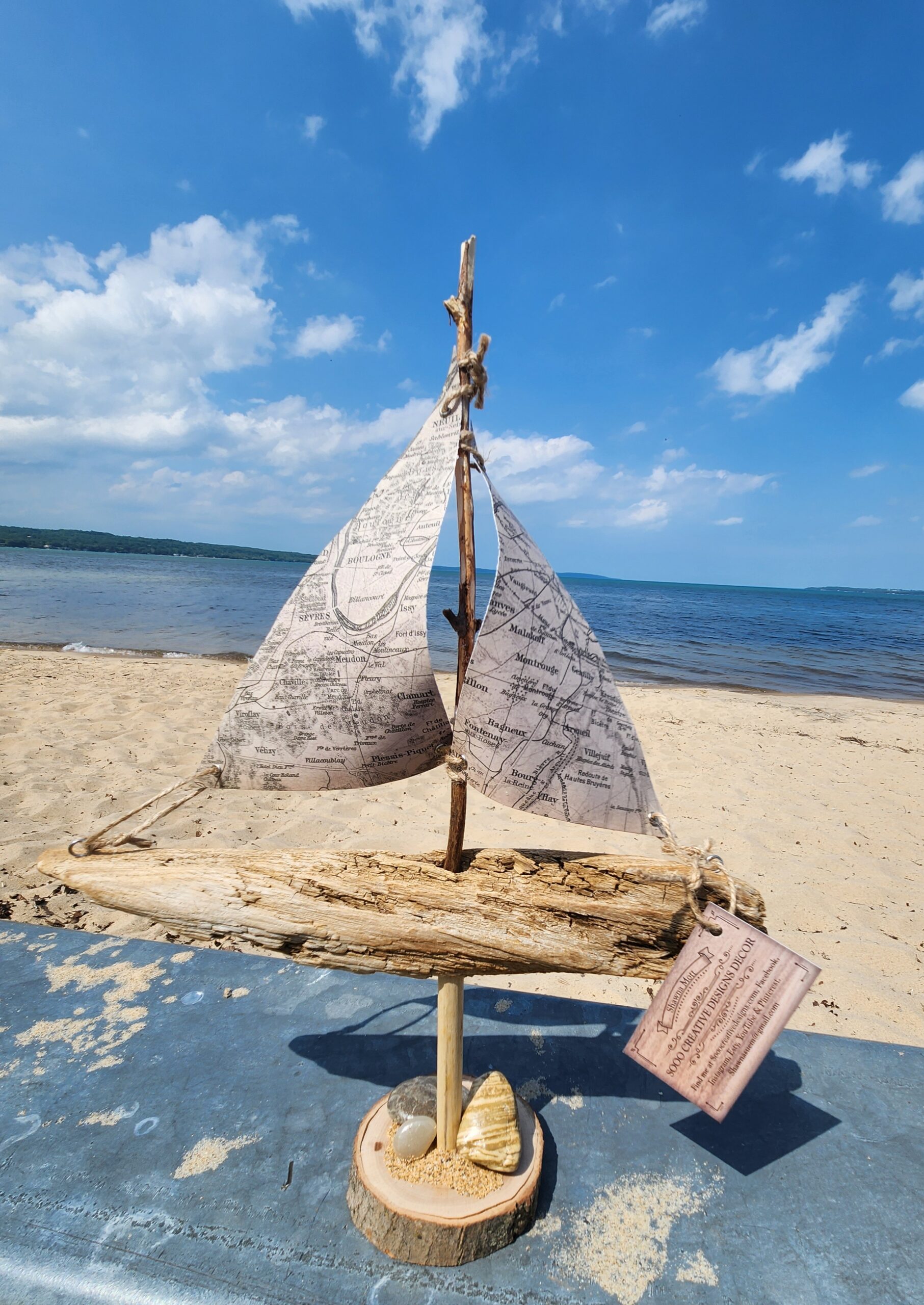 A Unique Sailboat Crafted from Driftwood, Petoskey Stones, Sand, and Map Sails - Made in the USA